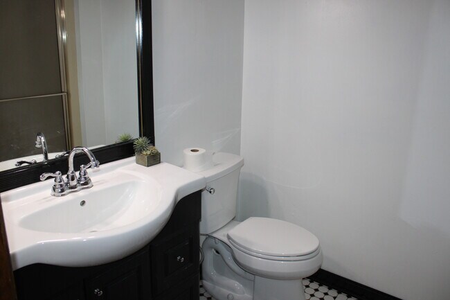 Main Level Bathroom with Shower - 2115 Pineshore Ct