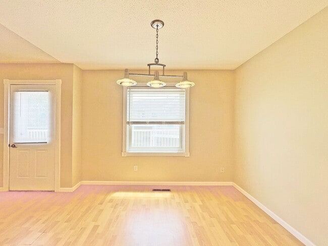 Building Photo - Beautifully Redone Modern Townhome with Large Deck, 2-Car Garage, Granite Kitchen, Vaulted Ceilin...
