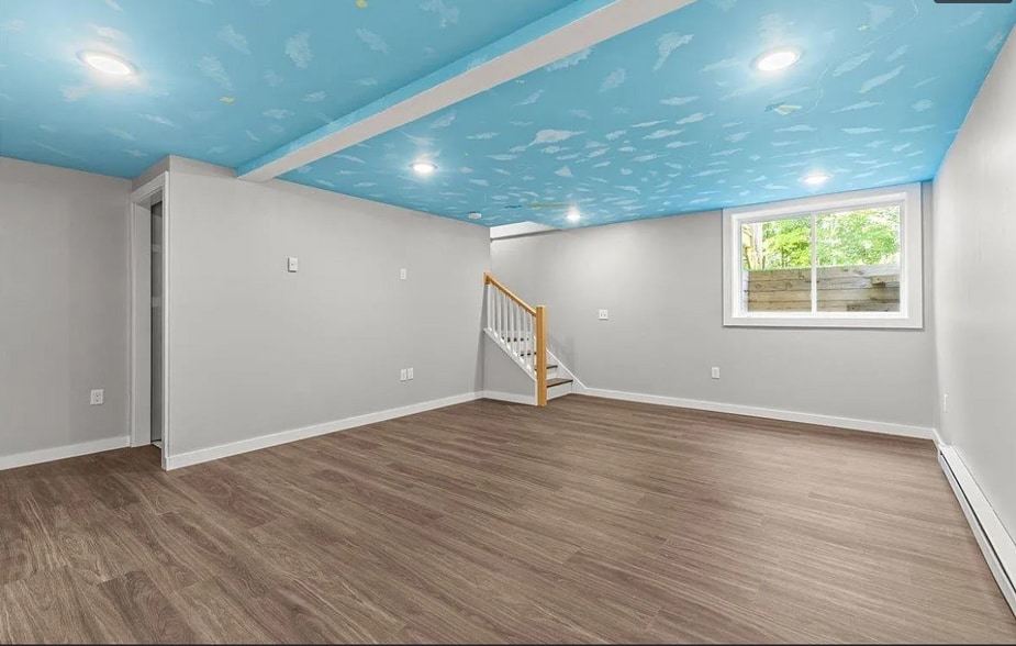 The downstairs is bright with high ceilings, an enormous closet/storage area & washer/dryer hookups. - 24 Wilsons End Pl