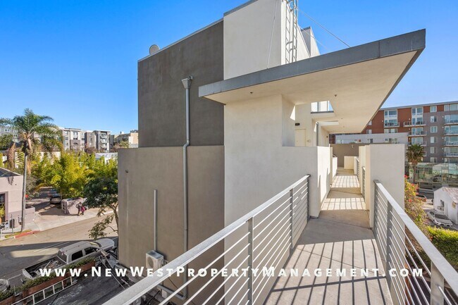 Building Photo - Views, Views, Views! Stunning Top-Floor Little Italy 2-bedroom Loft at The Waterfront!