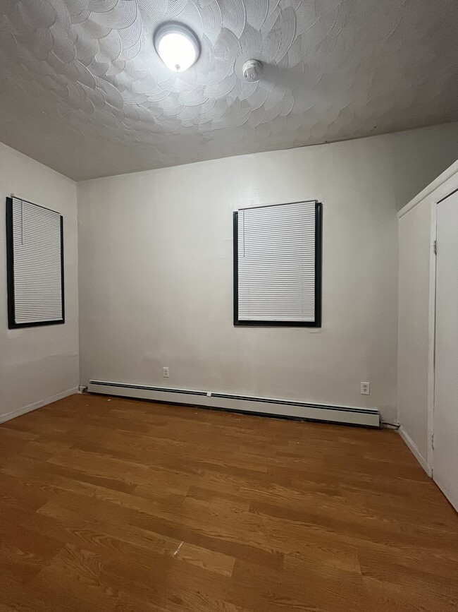 Bedroom #3 - new paintwork and baseboard heater - 125 S 9th St