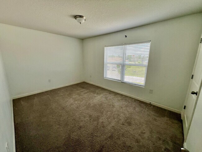 Building Photo - Spacious 4-Bedroom Home with Primary Suite...