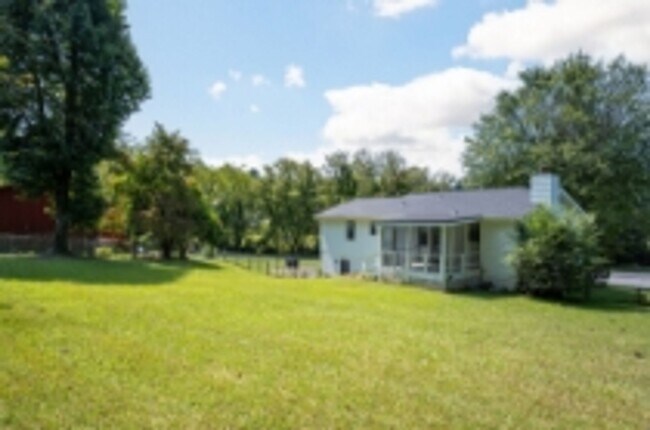 Building Photo - This beautifully updated brick home in Har...