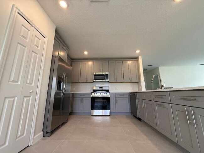 Building Photo - GORGEOUS, Large Completely Renovated Two-Story 4/2.5 PLUS LOFT in POINCIANA VILLAGES!