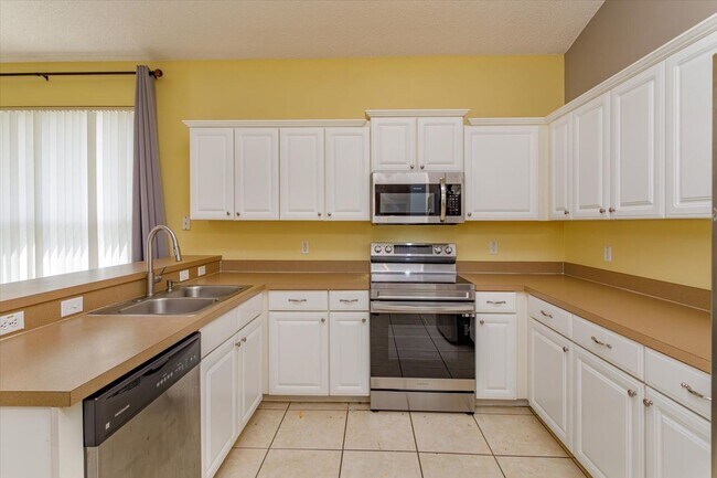 Building Photo - High Ceilings, Gourmet Kitchen, and a Playground – Where Life's Little Pleasures Meet!