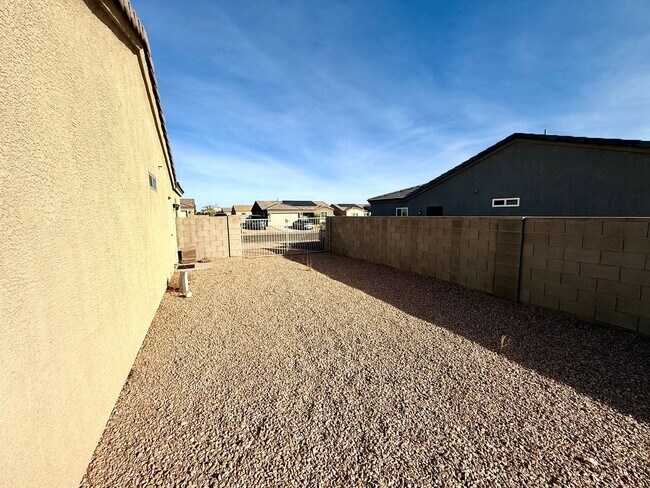 Building Photo - Great 4 Bedroom Home with Drive Through Side Gate!