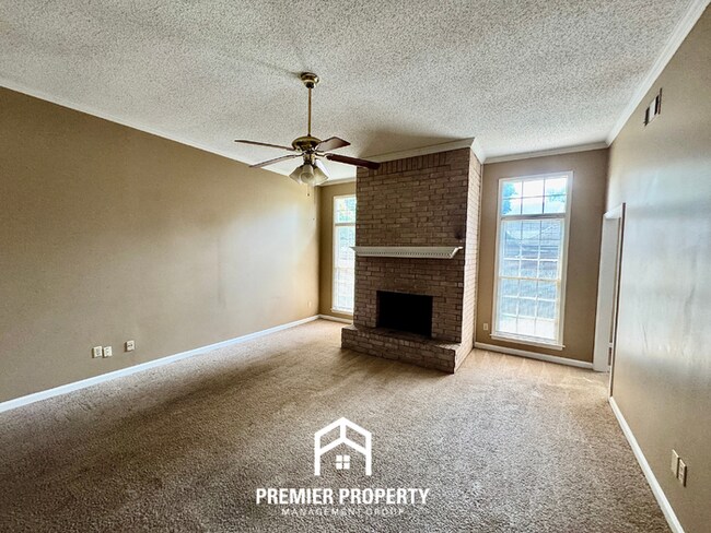 Building Photo - Spacious 3BR/2BA Near Southwind | 1,958 Sq Ft, Brick Fireplace, 2-Car Garage & Quiet Cove