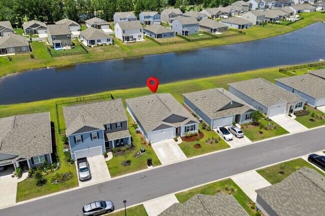 Building Photo - Modern 4BR Home with Screened Porch & Pond Views | Sun Colony, Longs SC
