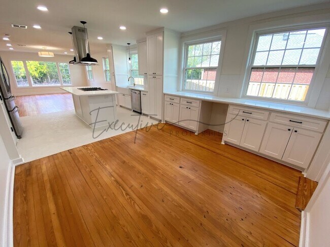 Building Photo - Spacious 4-Bedroom with Custom Finishes in...