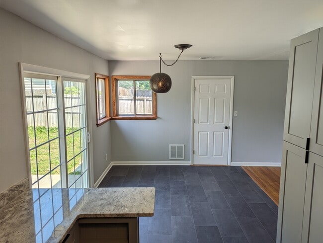 Light filled dining room. - 2008 E Huntsville Rd