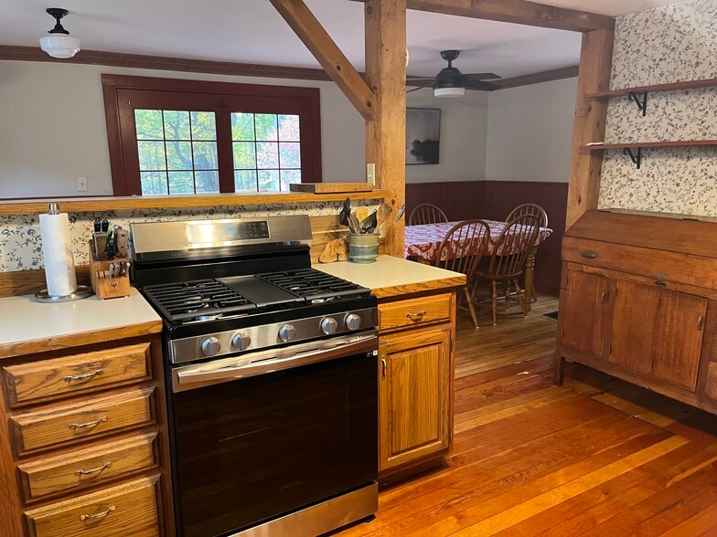 Antique hutch and spacious dining area that leads to back deck. - 11 Kellogg St