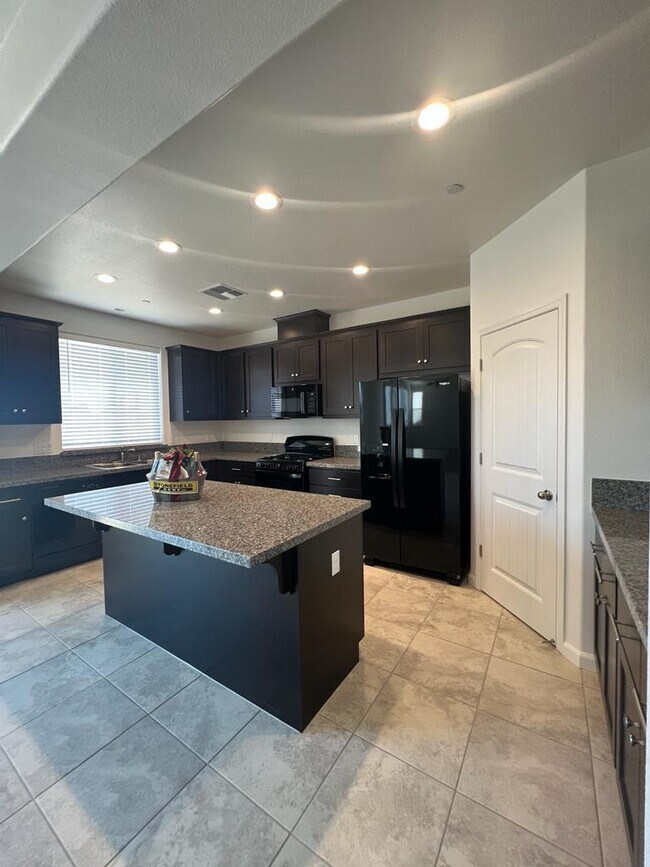 Building Photo - Spacious 4-Bedroom Retreat with 2.5 Baths in Los Banos – Your Ideal Family Home Awaits in a gated...
