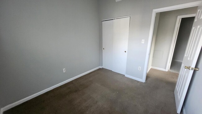 Building Photo - "Spacious 3-Bedroom Townhouse with Finishe...