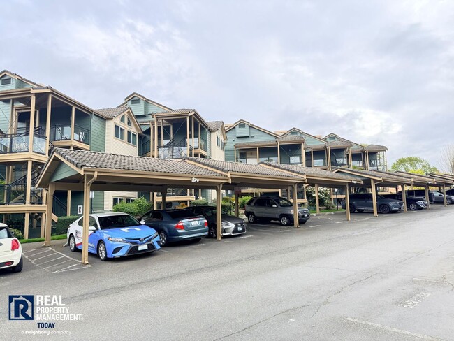 Building Photo - Updated 2 Bed Condo Near the Narrows – Water Views, Covered Parking & Prime Tacoma Location!