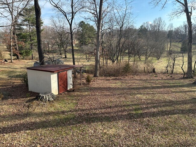 Building Photo - House in Bedford with Lot of Outdoor Space.