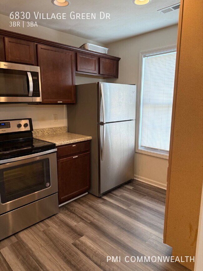 Building Photo - 6830 Village Green Dr