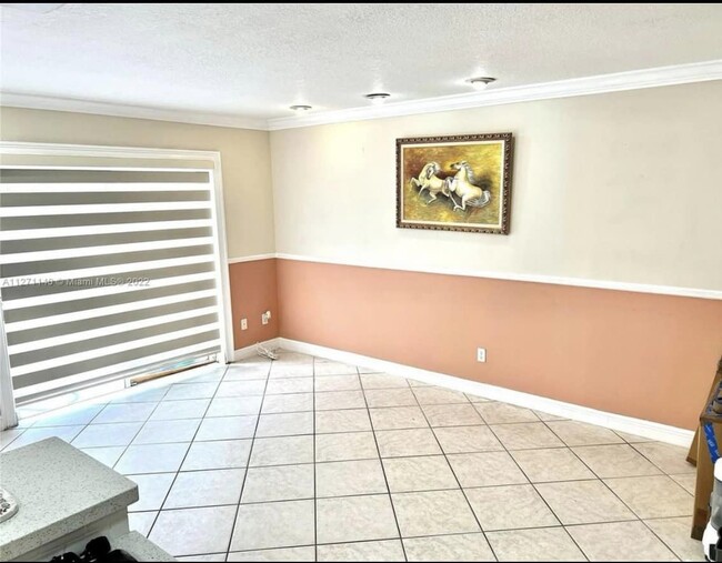 Living room with modern blinds - 13918 SW 172nd Ter