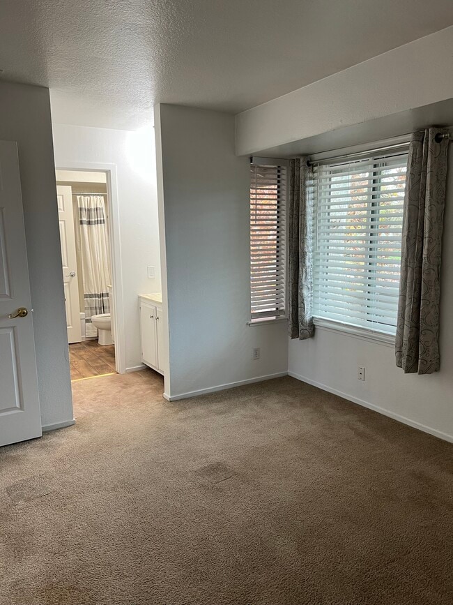 Primary room with vanity next to bathroom - 1830 Polk Way