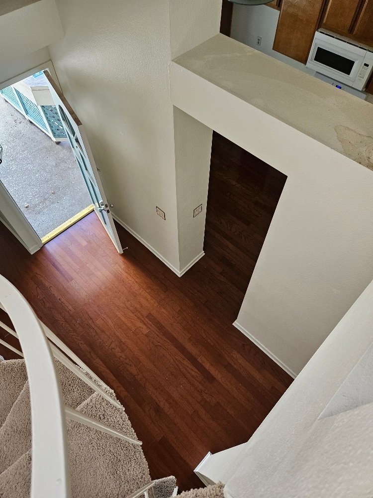 looking down from the loft to the entry - 7532 Seaspring Dr