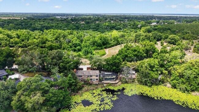 Building Photo - Available Now! Waterfront Living at Its Best – Pool, Decks & Gated Privacy