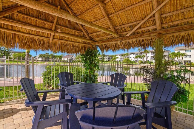 Building Photo - AVAILABLE NOW! Furnished Ground-Floor End Unit | Lake & Pool Views | Minutes to Marco Island & Do...