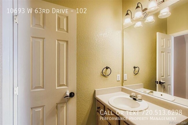 Building Photo - 10693 W 63rd Dr