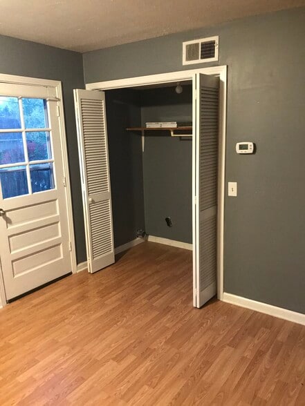 Laundry closet and door to fenced backyard - 1140 E Main St