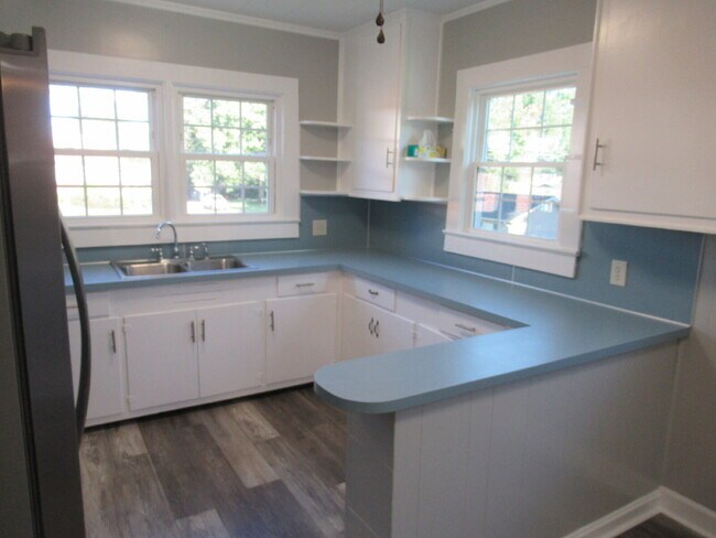Building Photo - Check out this beautifully renovated white...