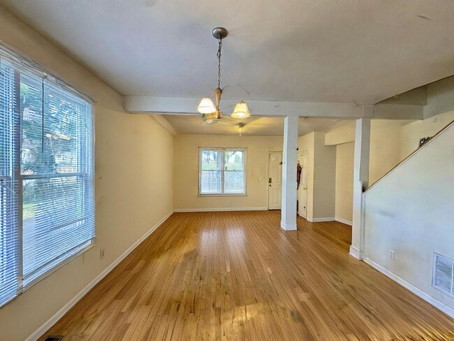 Building Photo - Spacious Three-Bedroom Townhome Convenient...