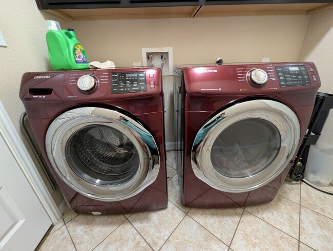 Laundry room-washer and dryer included in rental - 2432 Etta May Ln