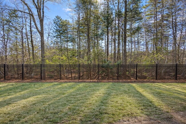 Building Photo - Gated Johns Creek Townhome Offering Space, Privacy, and Everyday Convenience