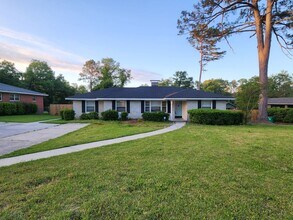 Building Photo - Spacious 4BR/2BA Brick Home with Fireplace, Large Island & Expansive Deck!