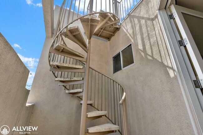 Building Photo - Spacious Coastal Condo with Rooftop Ocean ...