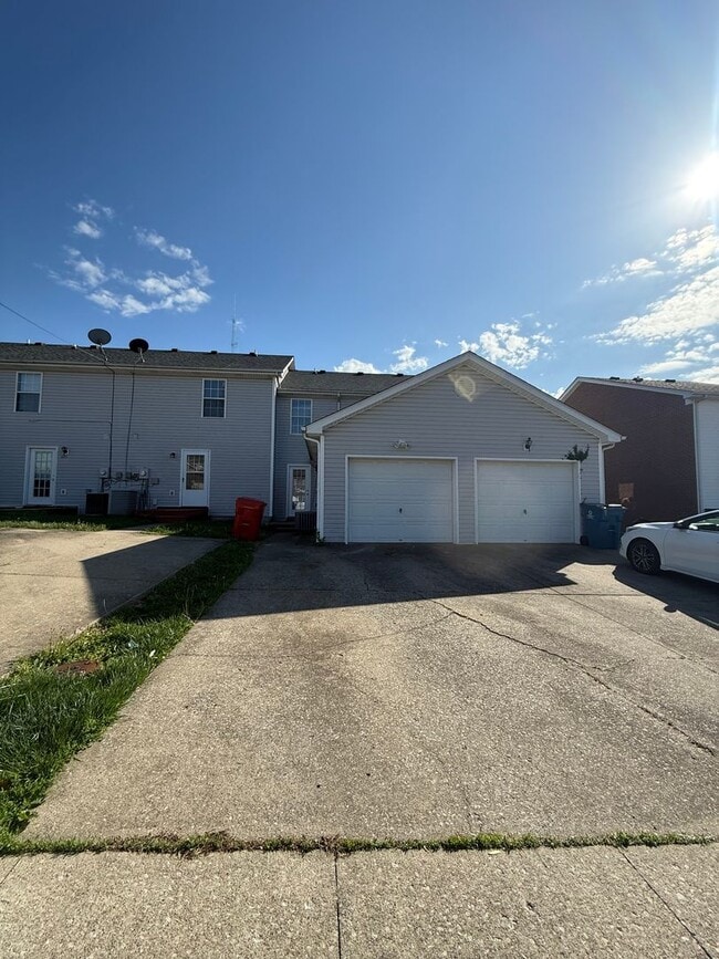 Building Photo - 2-bedroom, 1.5-bath townhouse with an attached garage