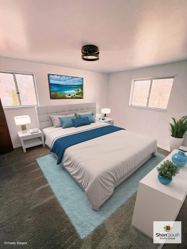 Building Photo - Updated - 2 bed 1.5 bath, Duplex with attached garage and fenced in backyard