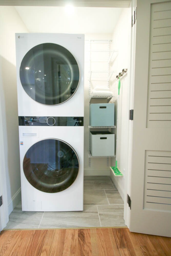 Separate laundry closet with new stacked washer/dryer combo and additional storage. - 2406 Boswell Rd