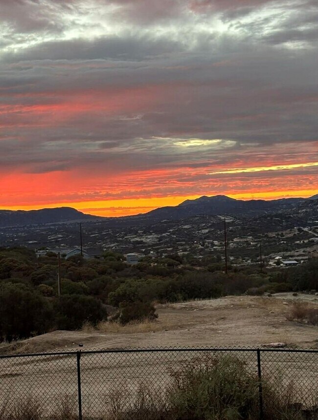 Building Photo - 4BR/2BA HOME w/ attached garage, usable land, fenced in back yard in CAMPO available!