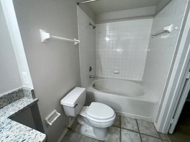 Building Photo - NEW-Remodeled bathroom & kitchen! NEW VINYL PLANK flooring & fresh paint! 2 bedroom 1 bath condo ...