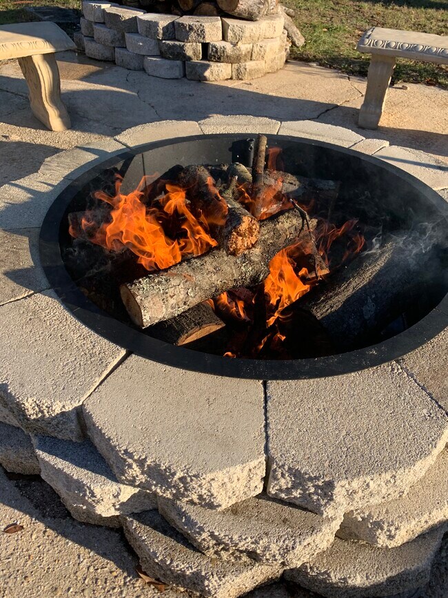 Have great conversations outside around the wood burning fire pit! - 1301 E Leonard St