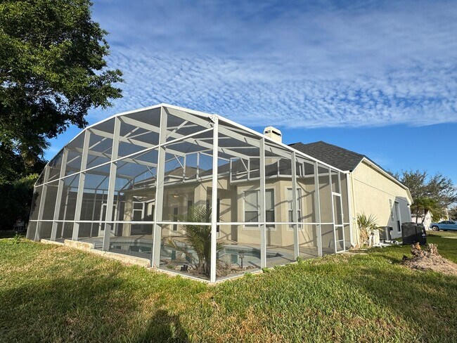 Building Photo - Spacious 4-Bedroom Home with Private Pool and Modern Comforts