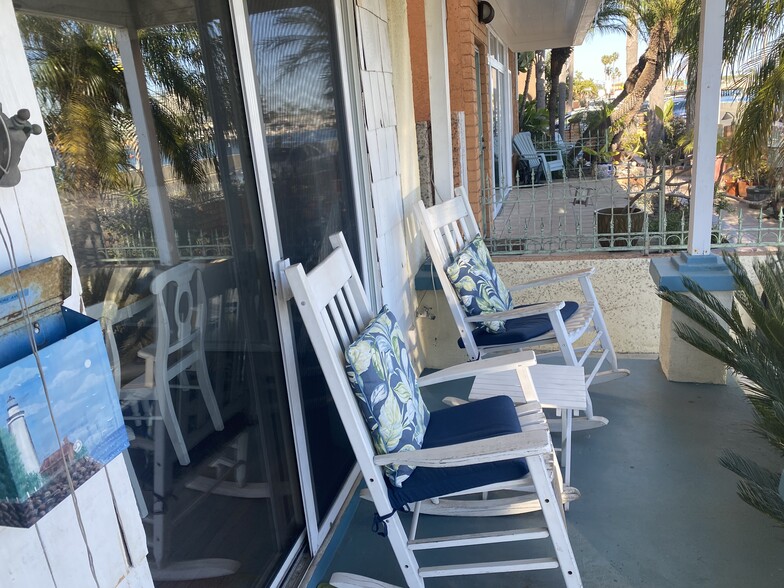 Front patio w/ rockers over looking bay beach - 117 Bay Shore Ave