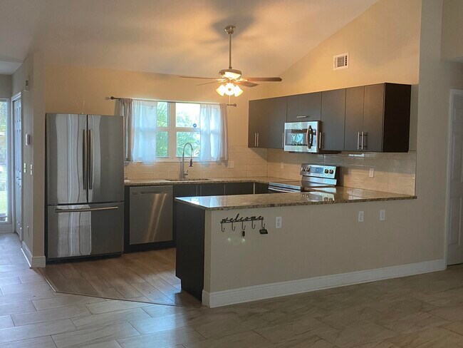 Building Photo - 3196 SW Areca Dr