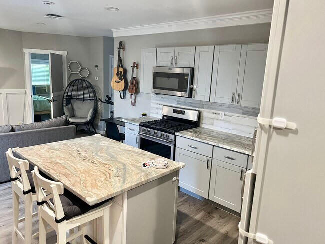Newly renovated kitchen with stainless steel appliances - 49 Glen Head Rd
