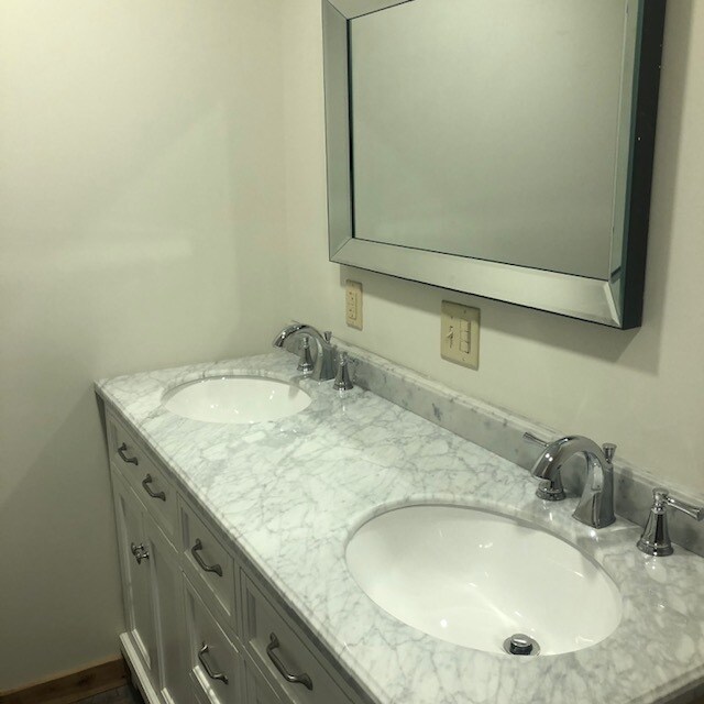 Double sinks in bathroom - 100 Monroe Ave