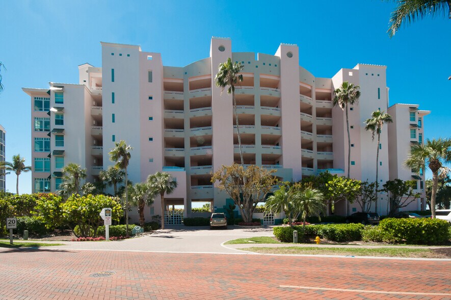building with covered parking spot - 253 Barefoot Beach Blvd