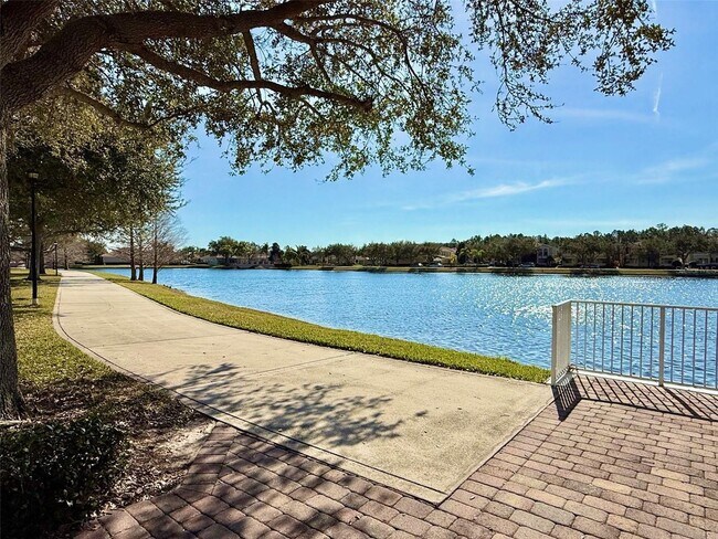 Building Photo - Gorgeous 2/2 + Den Mediterranean Villa with Waterfront Screened Patio and 2-Car Garage in the Pre...