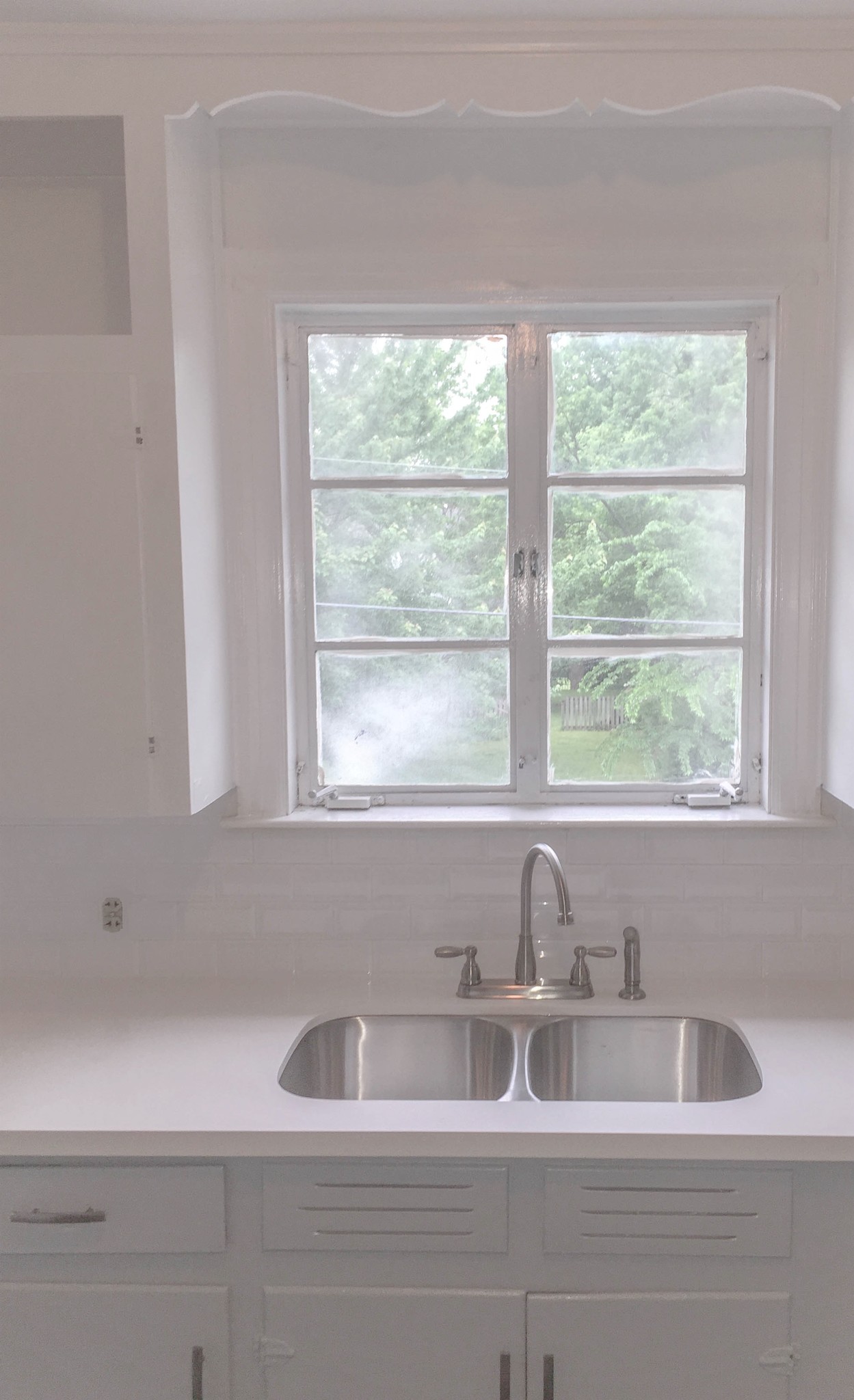 Quartz counter tops, beveled tile backsplash - 2001 Center St