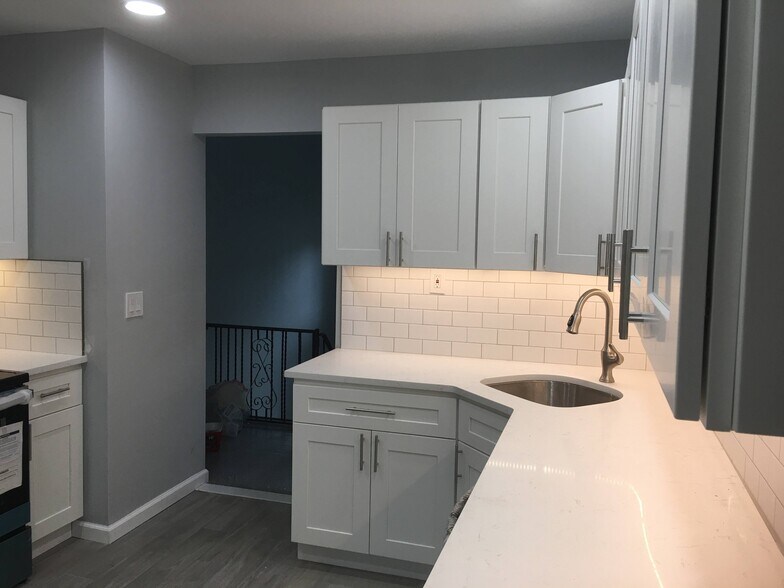 Kitchen includes deep corner sink. - 12 Mill Street
