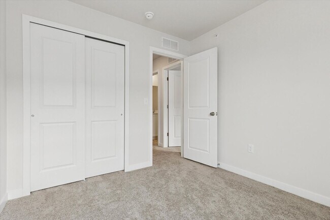 Building Photo - COMING SOON! Brand New River Pointe townhome with modern finishes, flexible living space, and a p...