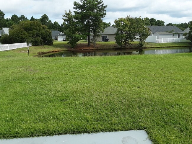 Building Photo - 1/2 off First Month Rent home has new flooring throughout.